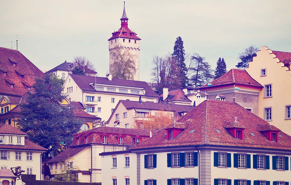 A view of some buildings and a tower.