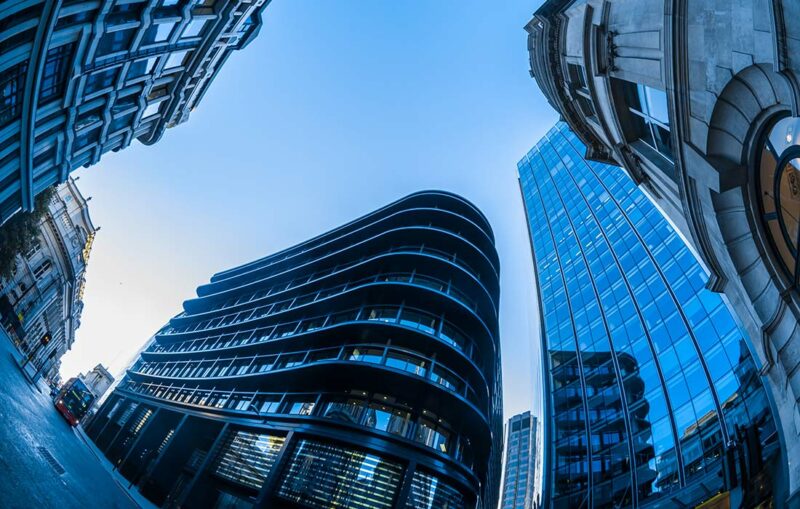 A view of some buildings from below the ground.