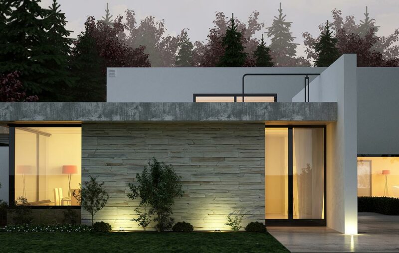 A modern house with a garden and trees