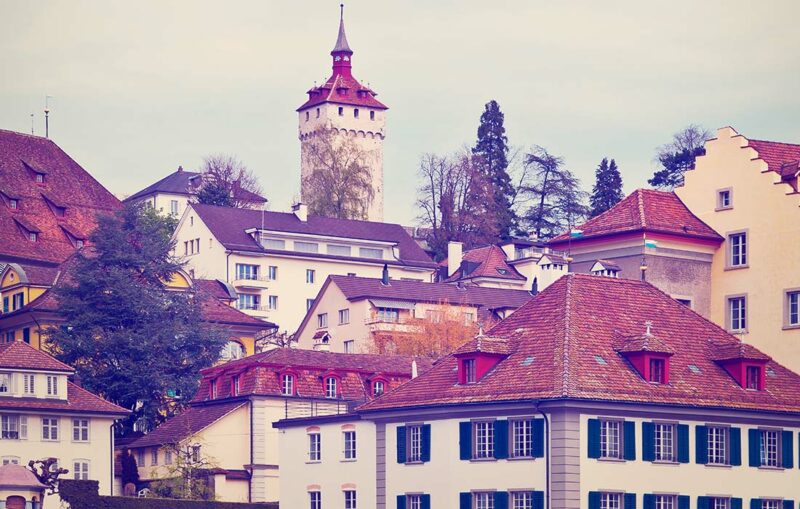 A view of some buildings and a tower.